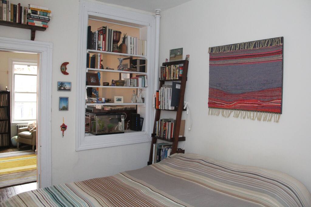 bedroom, leading into living room.