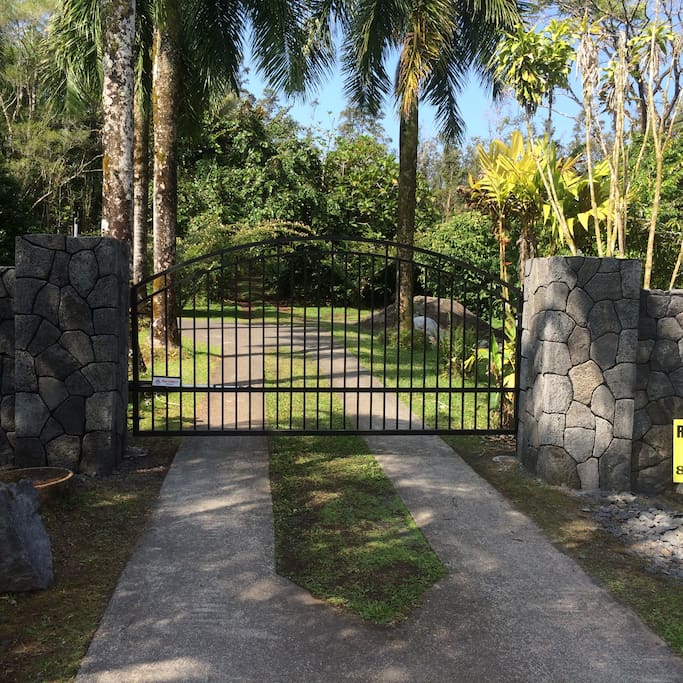 Gate entrance from street. The cottage is visible from the street.