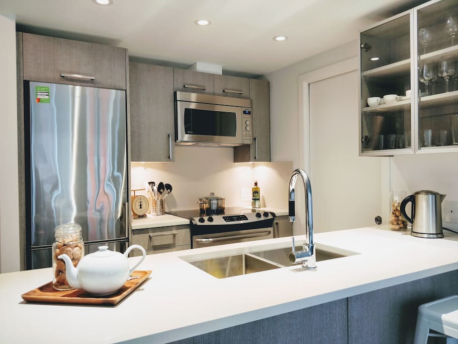 A brand new kitchen to prepare meals for the whole gang, with bar seating for two