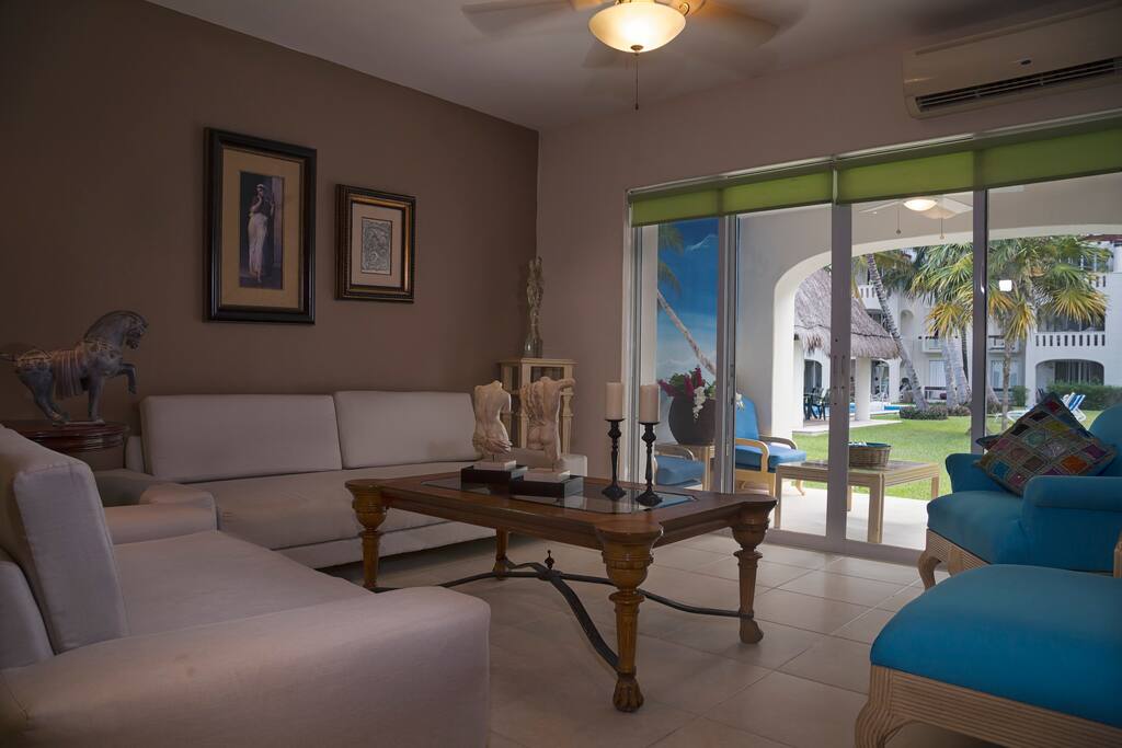 LIVING ROOM WITH POOL VIEW