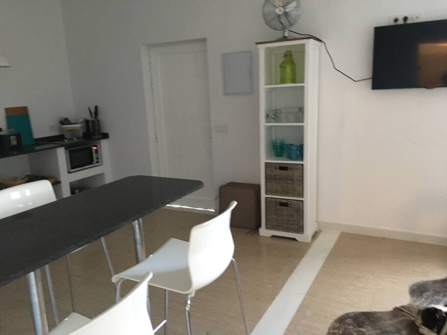 Breakfast bar divides the kitchen and lounge area