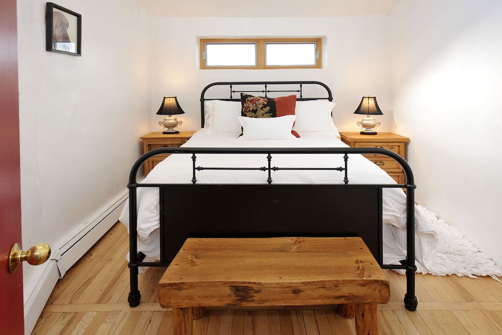 Guest bedroom with cozy double bed and fine linens.