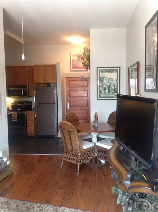 Dining room table and flatscreen TV with cable