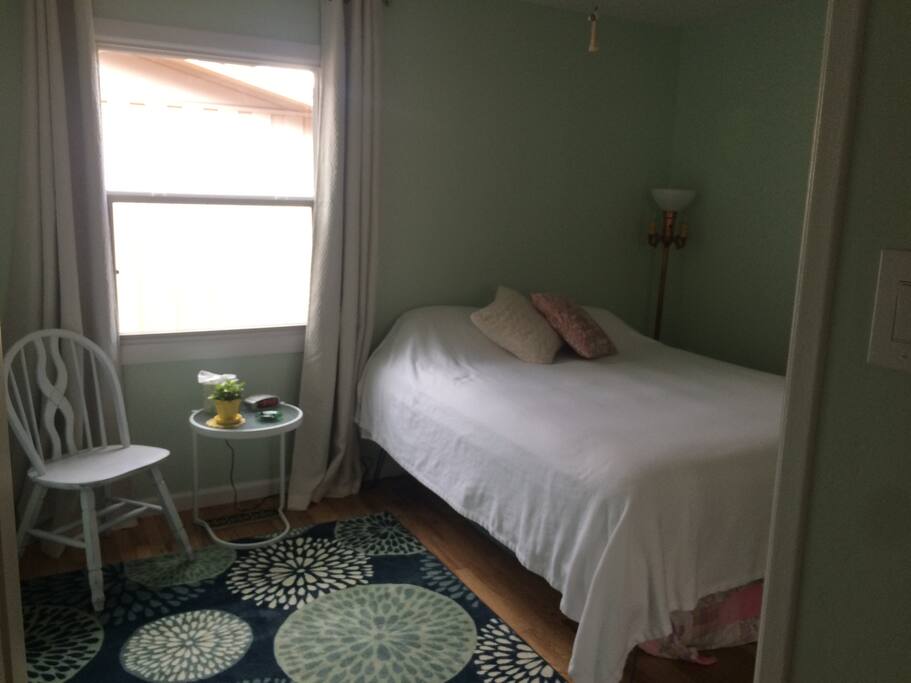 Private guest room with blackout curtains.