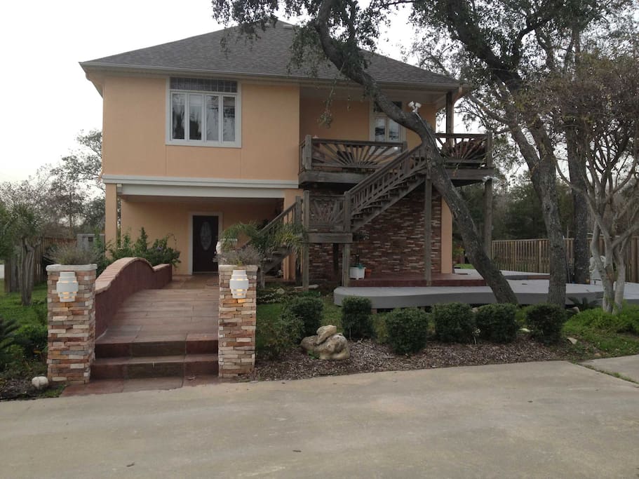 Front entrance, crossing the private bridge