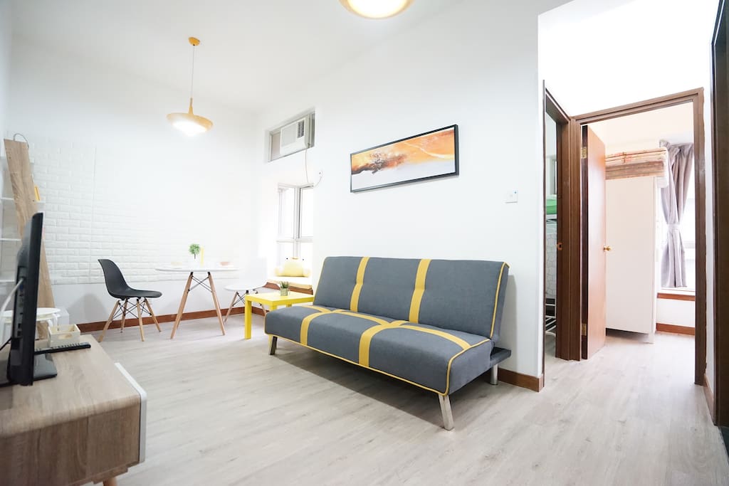 Spacious Living room with white painted wall and Sharp Yellow decoration.