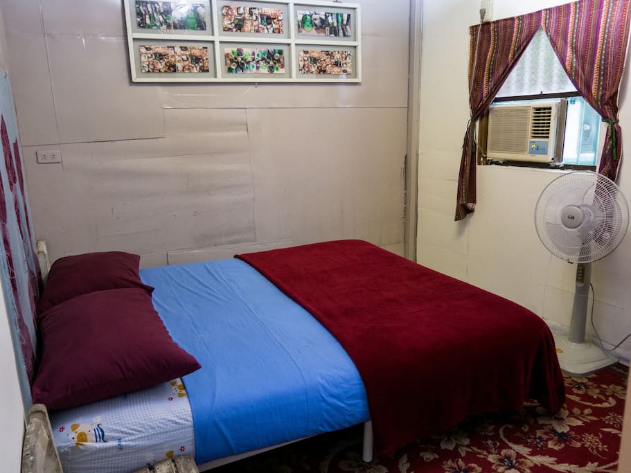 4 person room has a double bed, bunk bed and air conditioning.