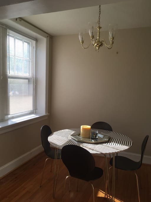 Dining room table with four chairs great for meals.