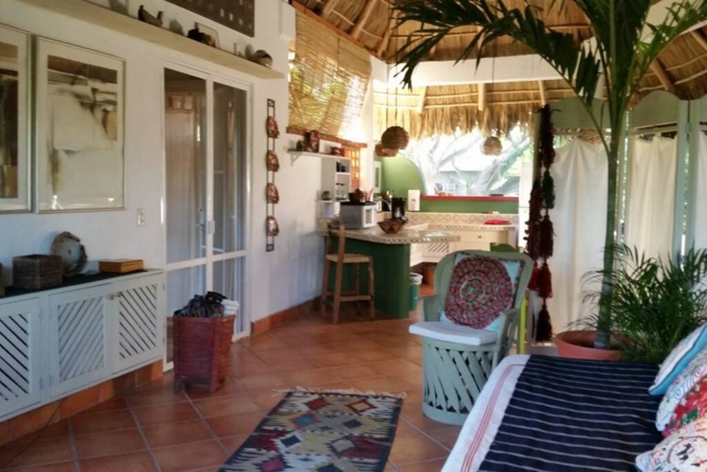 Living area to kitchen; bedroom doors left