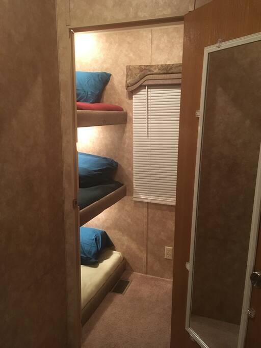 2nd Bedroom with 3 bunk beds & closet.