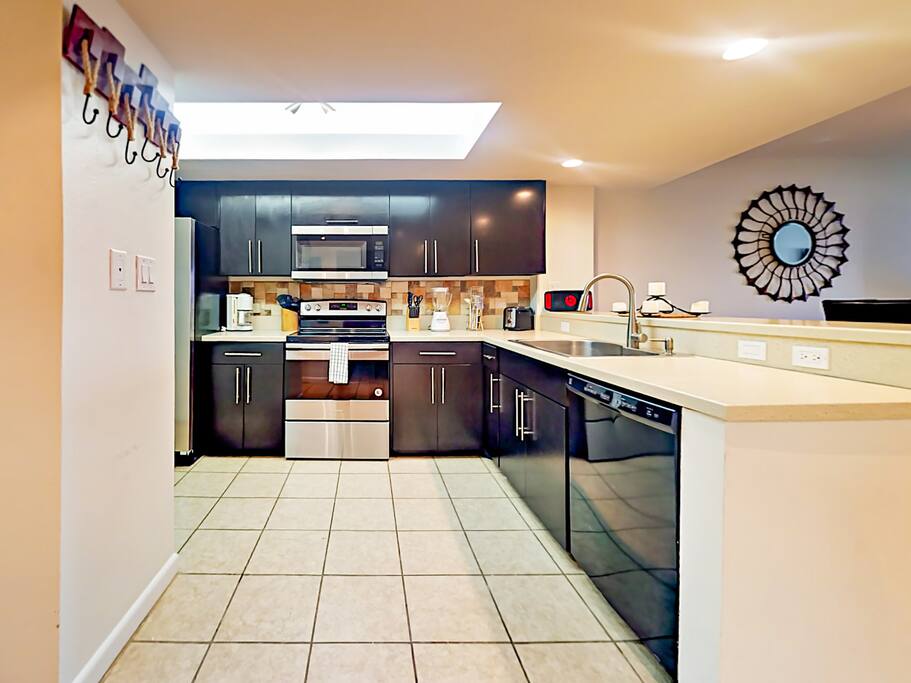 Large open kitchen offers ample prep space for the chef. Starter supply of kitchen amenities (dish soap, paper towels) included.