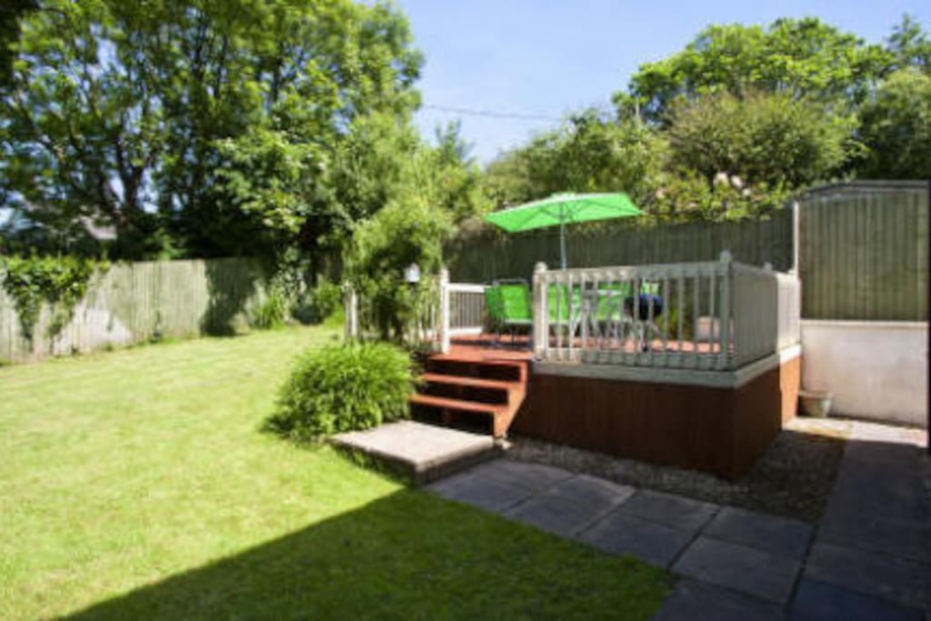 Sheltered and private garden with large decked area and patio furniture