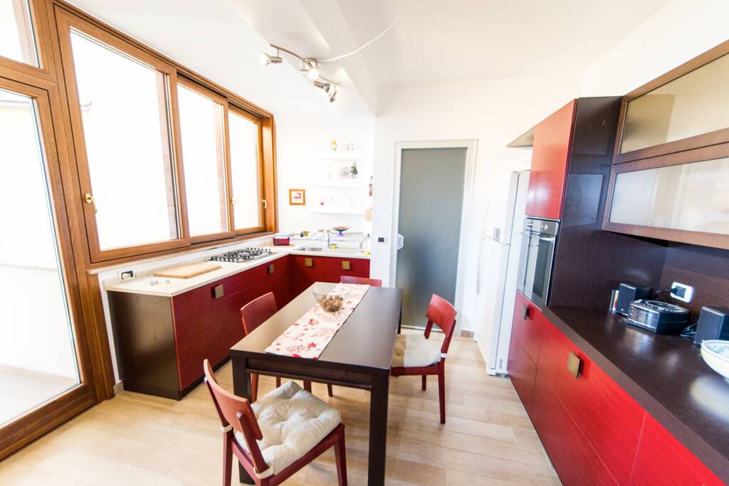 The kitchen and door towards the lavatory.