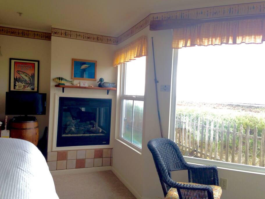 Views of the wetlands, a fireplace and TV with Cable