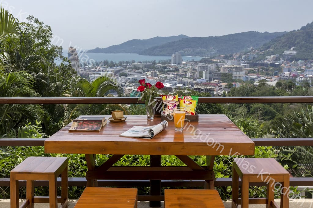 outdoor dining on the upper terrace with sea views and overlooking the private swimming pool