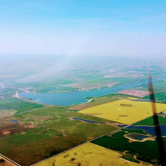 Aerial view - yellow canola fields visible