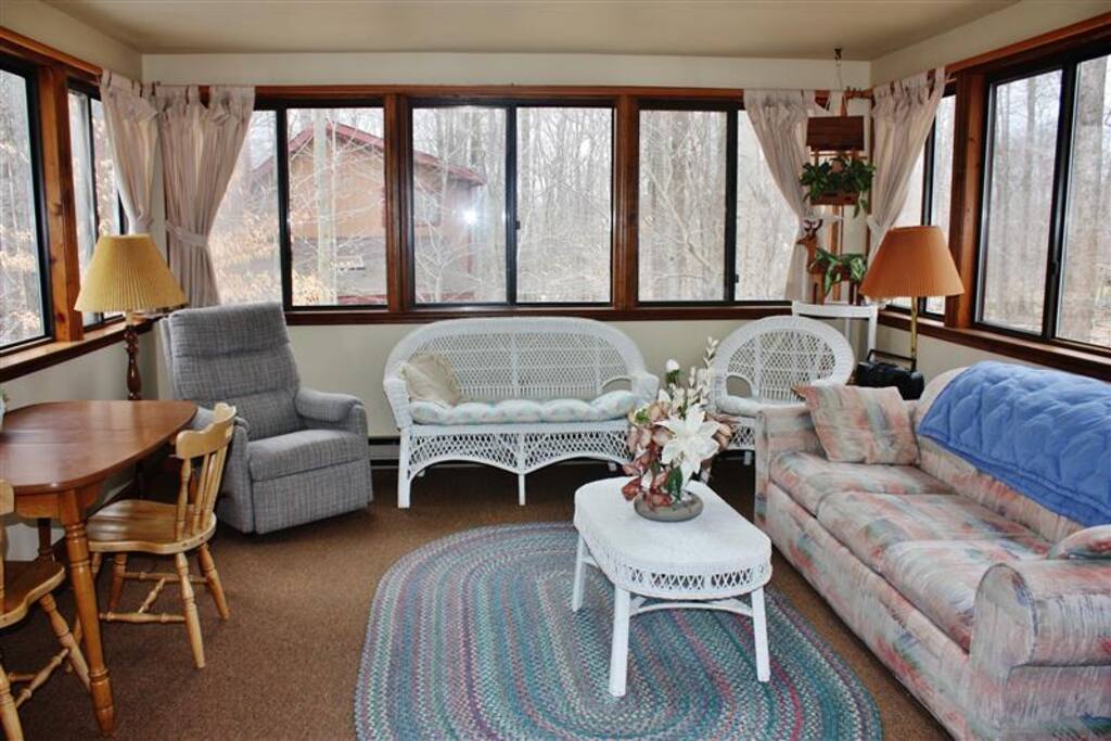 The bright sunroom offers wooded views & glimpses of wildlife!