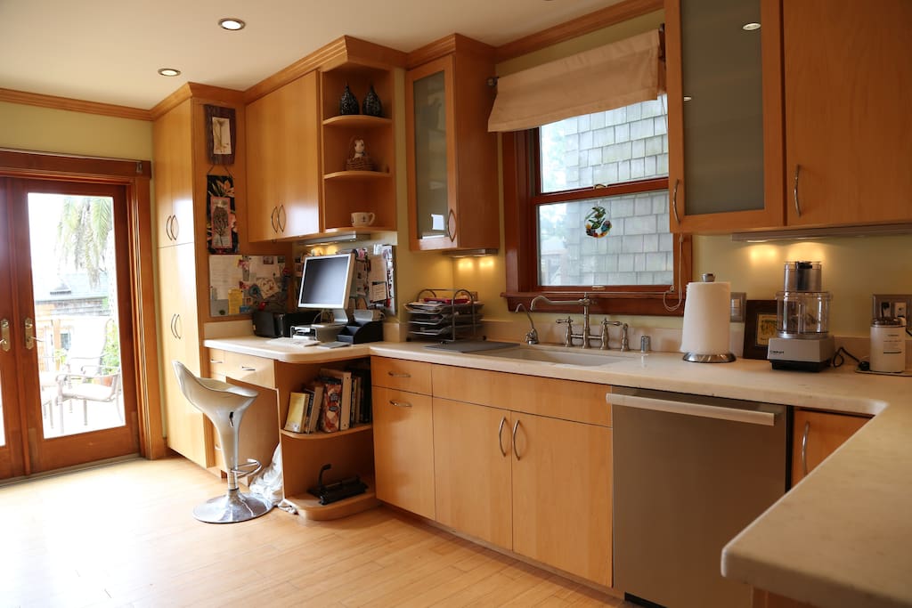 Feel free to use the bright modern kitchen. leads to relaxing deck