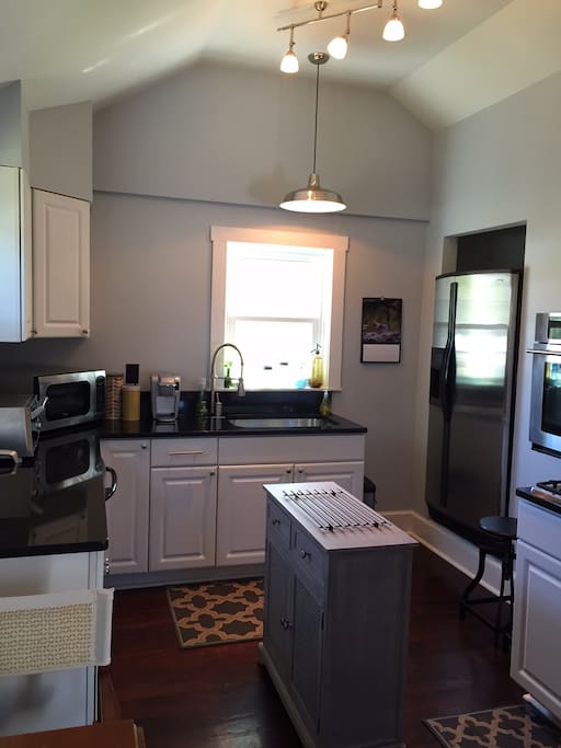 Modern kitchen includes microwave, dishwasher, toaster oven, ice maker/filtered water, tea kettle and Keurig