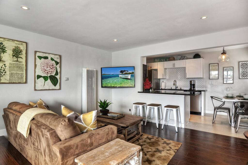 Vacation rental great room with kitchen, living area, two dining areas