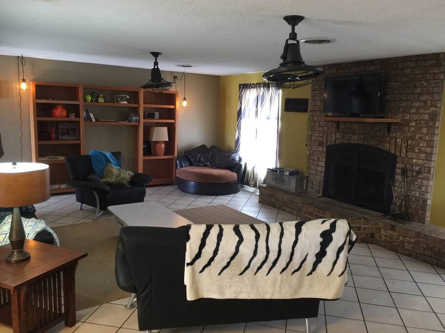 Living room with fireplace and flat screen tv above mantle