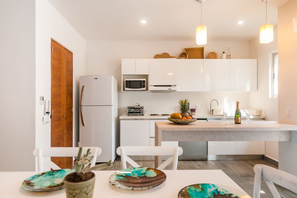 Dining area with a fully equipped kitchen