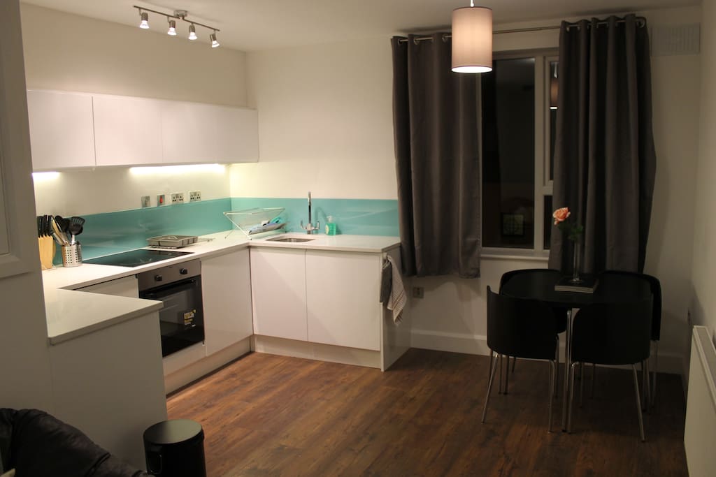 Kitchen equipped with integrated fridge and dishwasher, hob, oven, cutlery & crockery