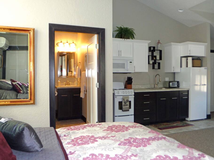 View from bed towards bathroom & kitchen
