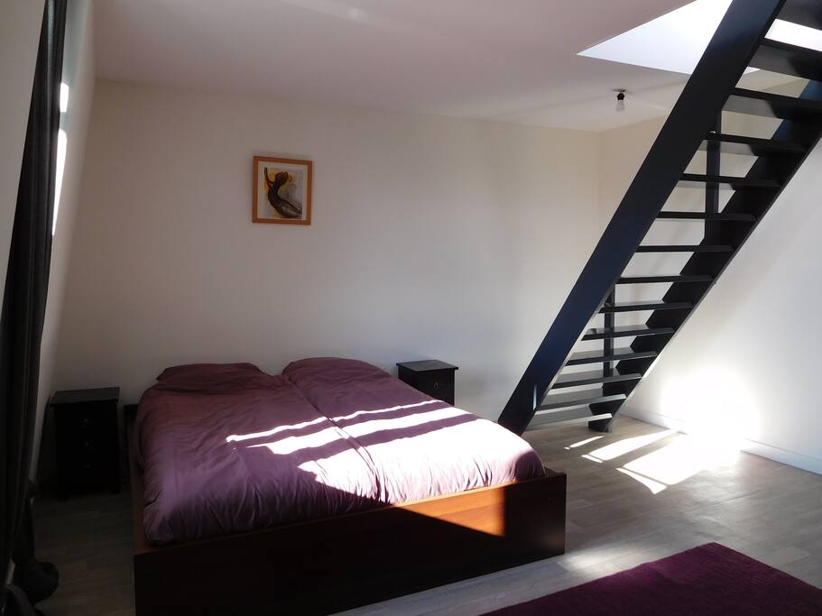 master bedroom with stairs to private roof terrace