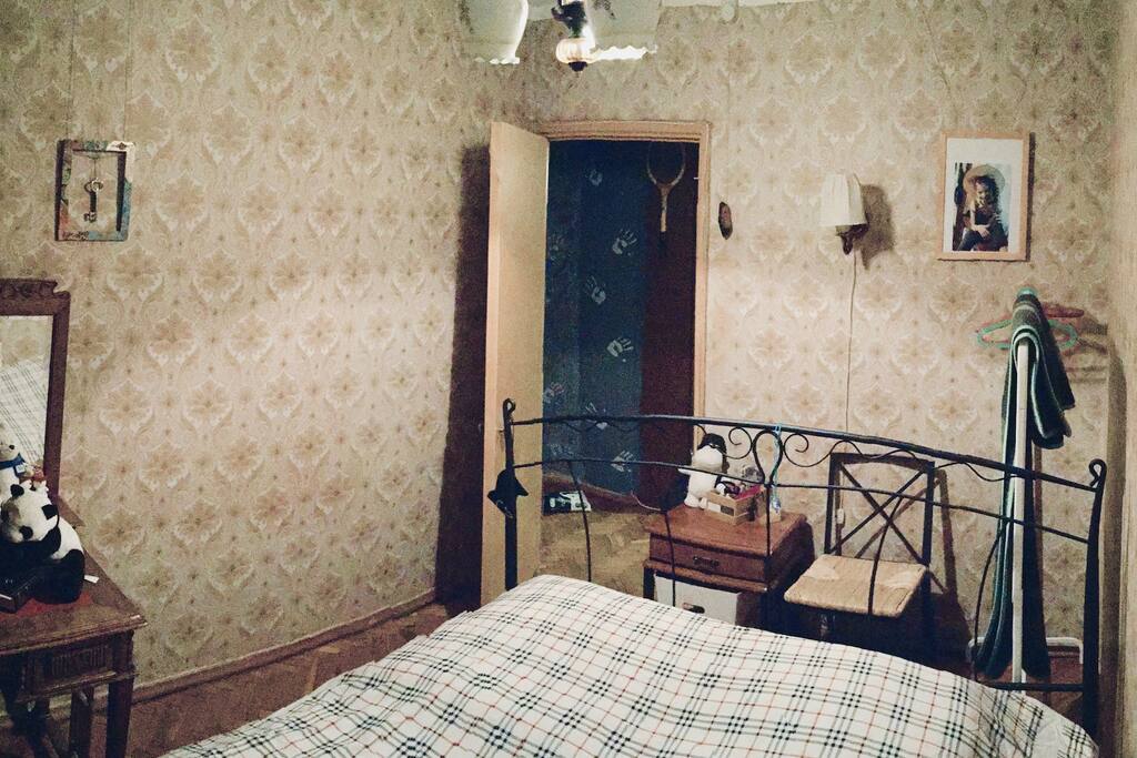 Bedroom. Bed is high enough to put your bags under it