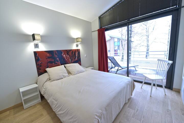 Terrasse privative dans la chambre parentale pour les chalets de plain-pieds
