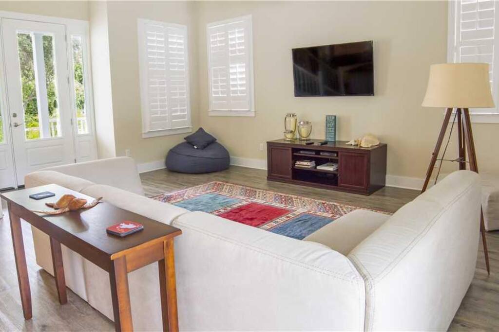 Gather in the lovely living room for movie night! - Pop a few bowls of popcorn, put a movie in, and settle into our generously st