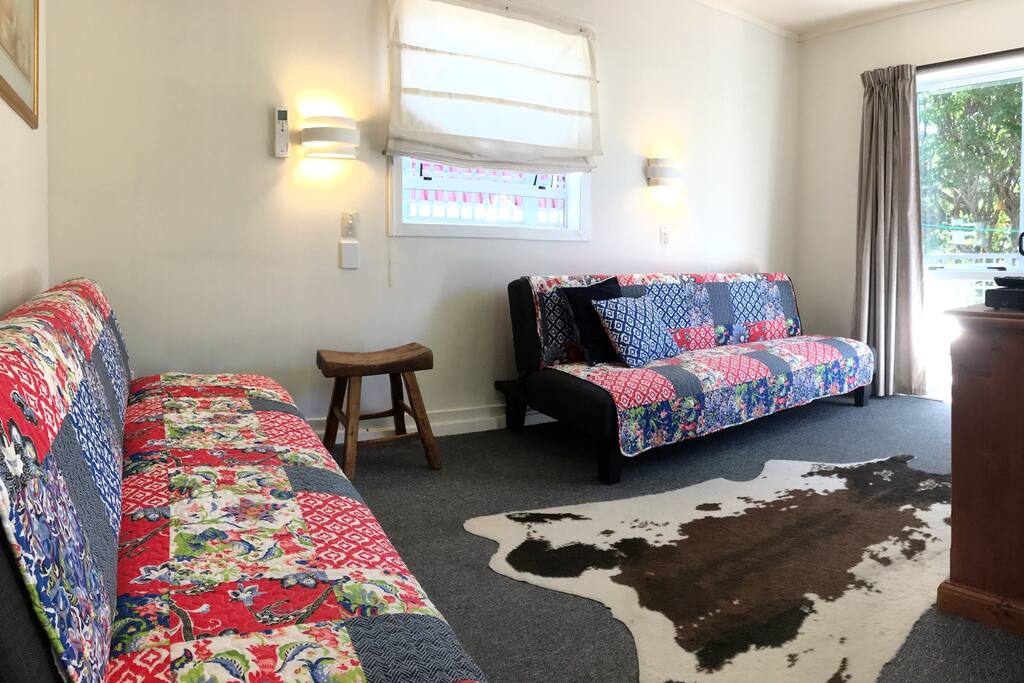 Sunny living area with 2x King-single sofa-beds.