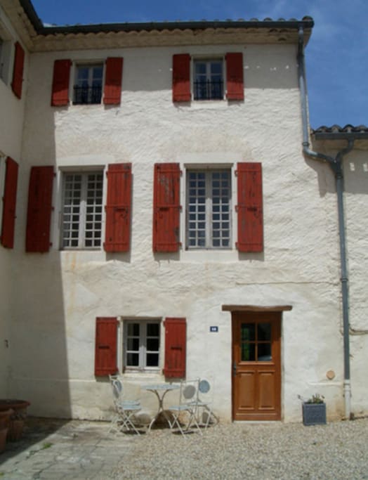 Front of house onto courtyard - lovely for breakfast in the morning
