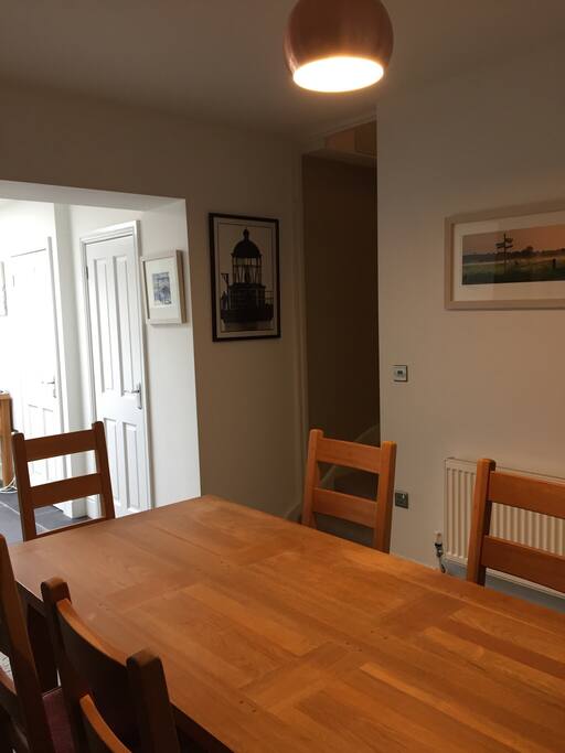 Dining area showing the stairs to the first floor.