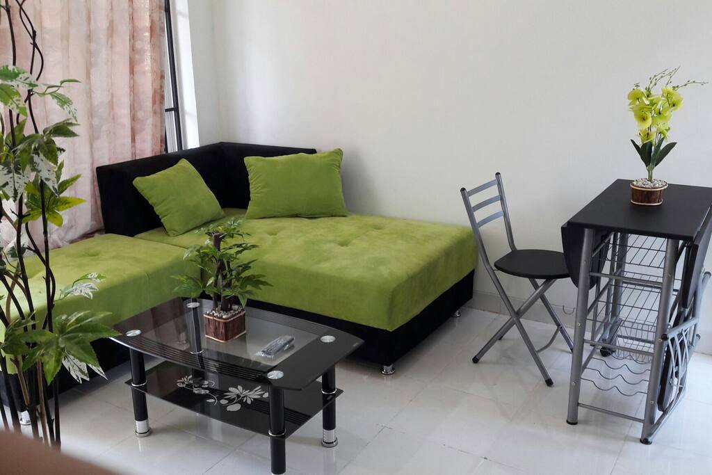 there is a small dining table with two chairs.
