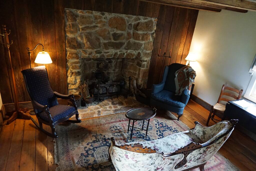Cozy sitting area with a dining/ worktable at the window, too!