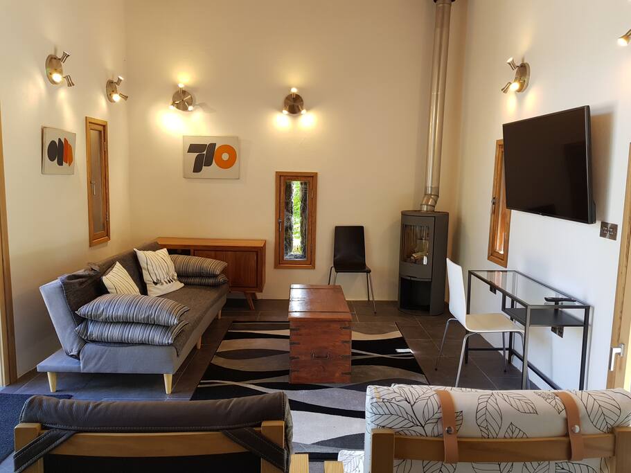 Living Area with underfloor heating and a modern Swedish woodburning stove.