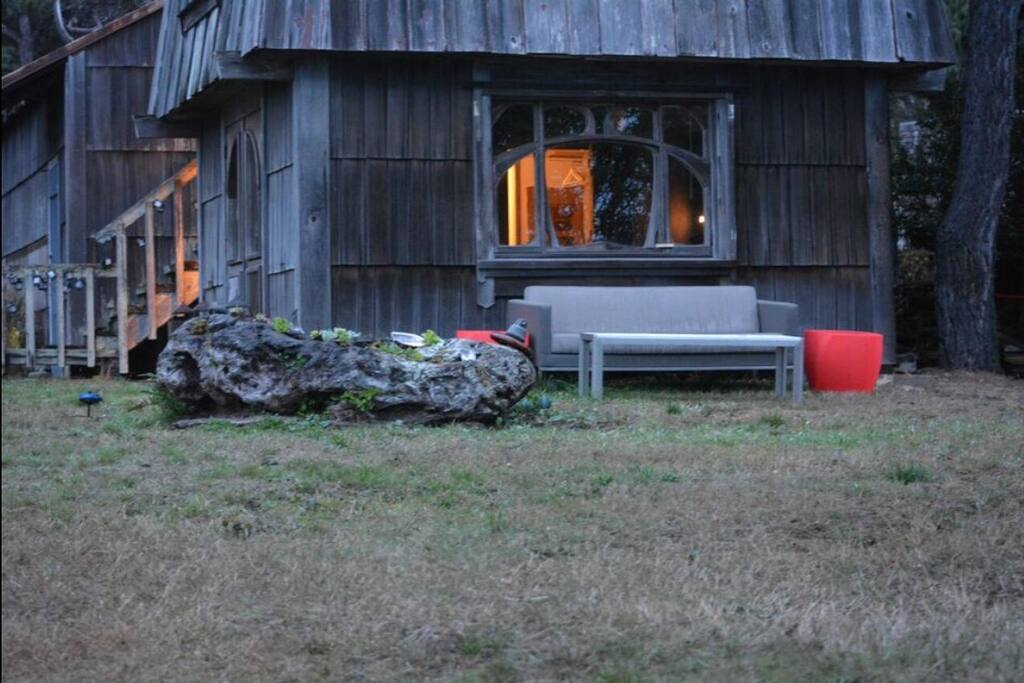 Cozy glow of your cabin area from outside...window beyond the sofa.