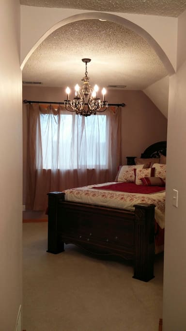 Master suite has very comfy Queen bed, chandelier, locking doors, laundry, and lockable access to full bath.
