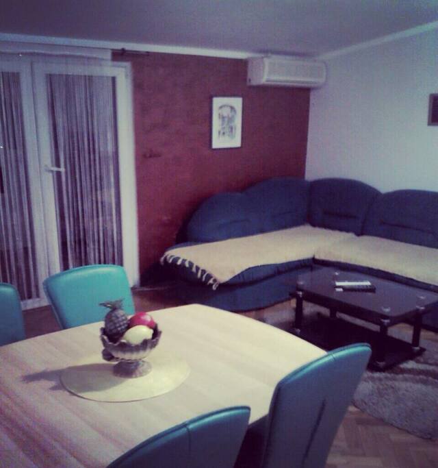 In the living room is the dining table for 4 people