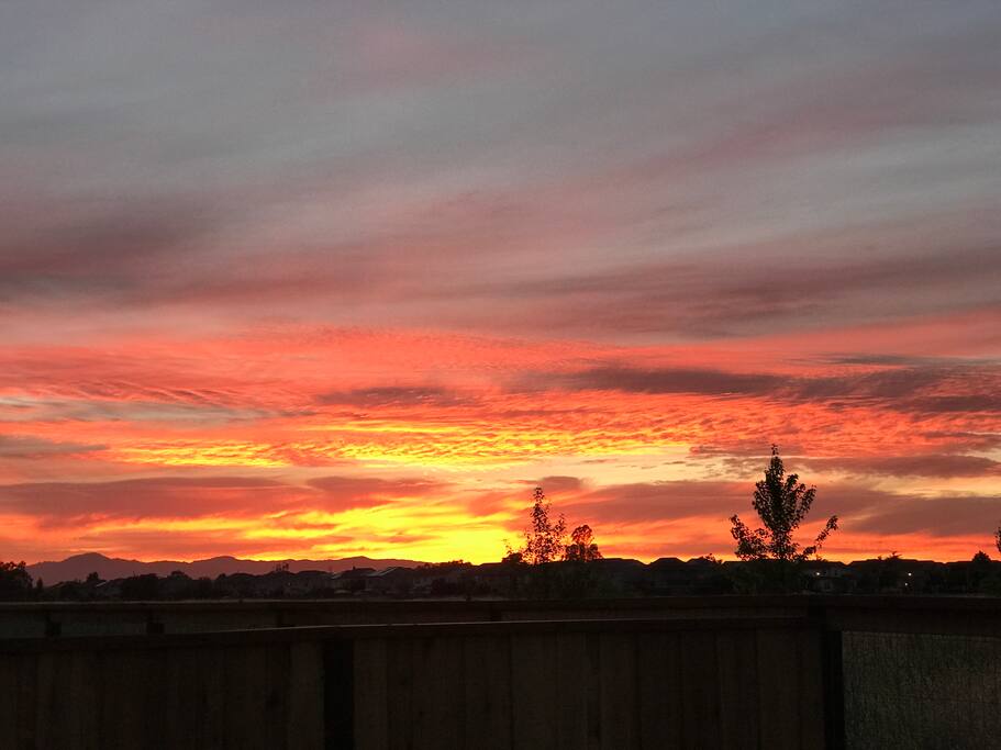 20 minutes to the ocean where that sunset is; view from backyard. Vineyards and giant redwoods on the way