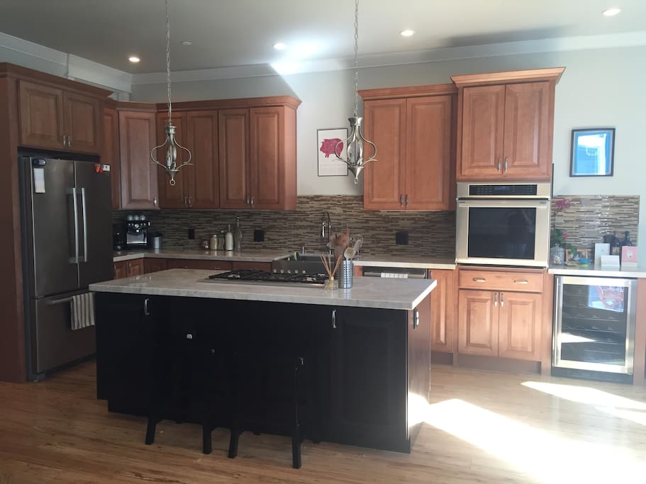 Large, open kitchen with brand new appliances throughout
