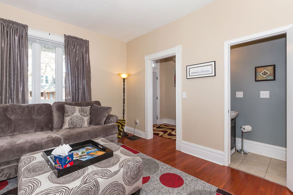 This bright and stylish room has a half bath so you don't have to miss your entertainment.