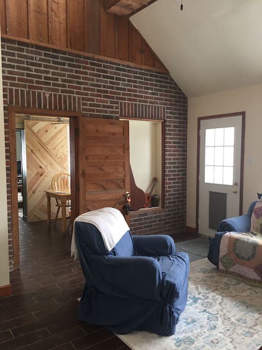 Semi private family room. The entry door is in this room but I’ll close the sliding door on the other side of the kitchen to give my guests more privacy in the living spaces. Door opens to deck which overlooks Brush Creek