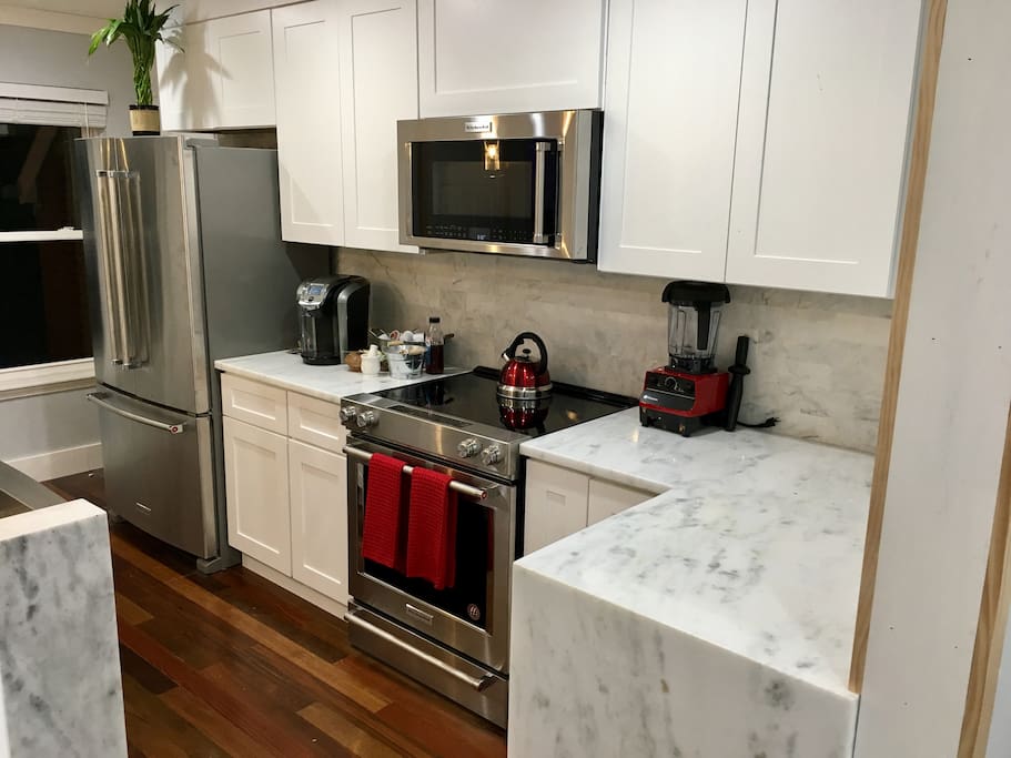 KITCHEN APPLIANCES
New matching stainless steel KitchenAid appliances: Refrigerator, glass top electric stove, microwave, dishwasher, apron sink.