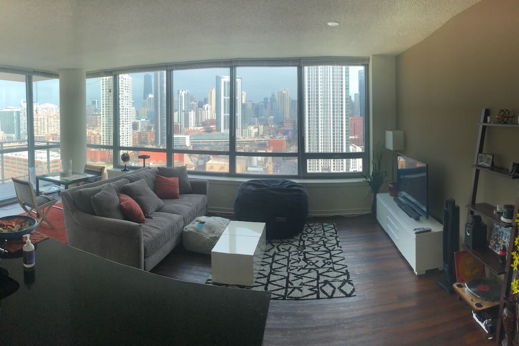 Upscale living room with abundant natural light and incredible city views!!
