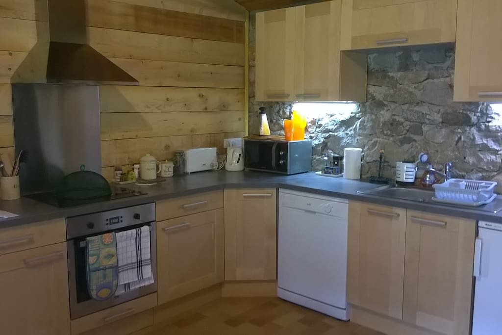 New kitchen in stone and wood