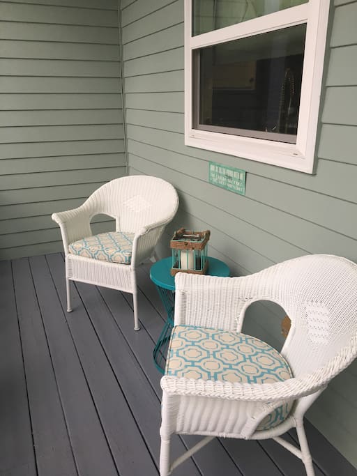 The front porch at Mermaid Cove is perfect for enjoying a good book or cup of coffee