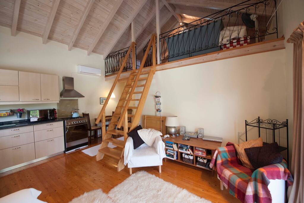Kitchen area with cooker,microwave, toaster, full kitchen utensils.